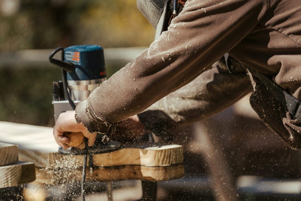 Carpenter cutting cedar boards for a sauna build